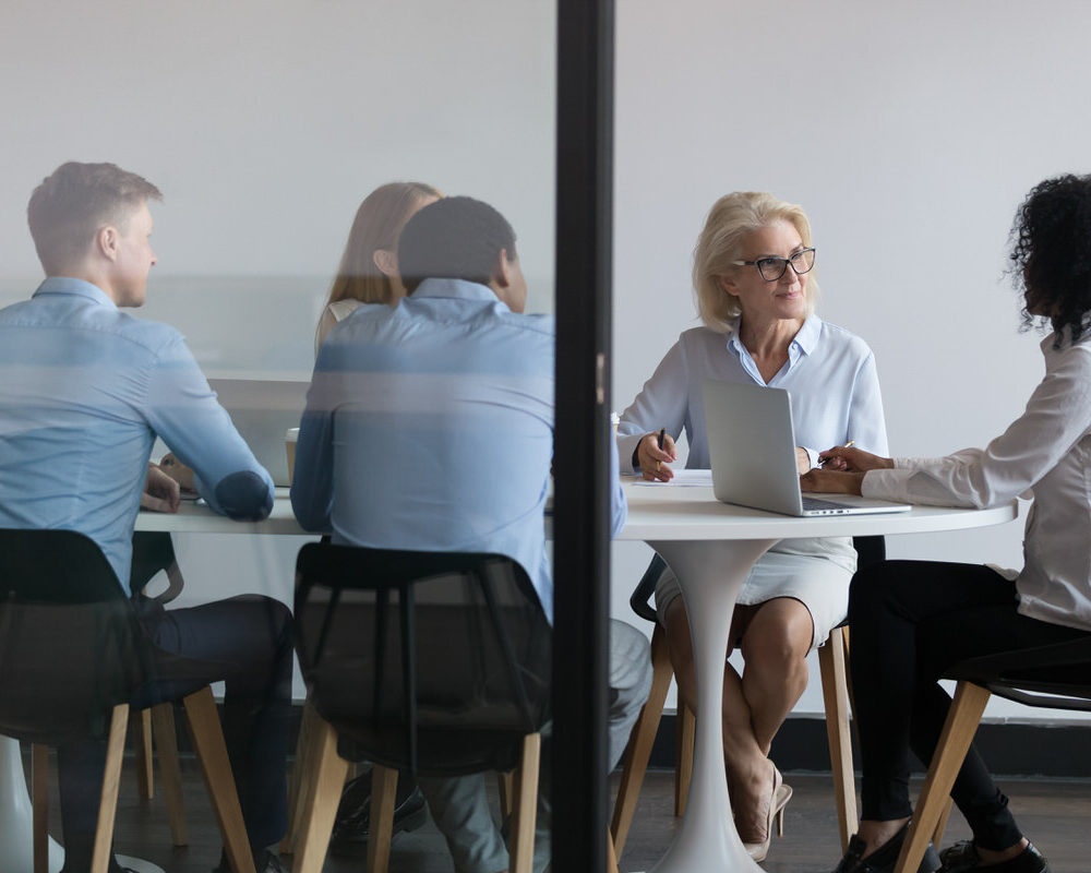 Employees,Listening,To,African,American,Team,Leader,At,Meeting,In