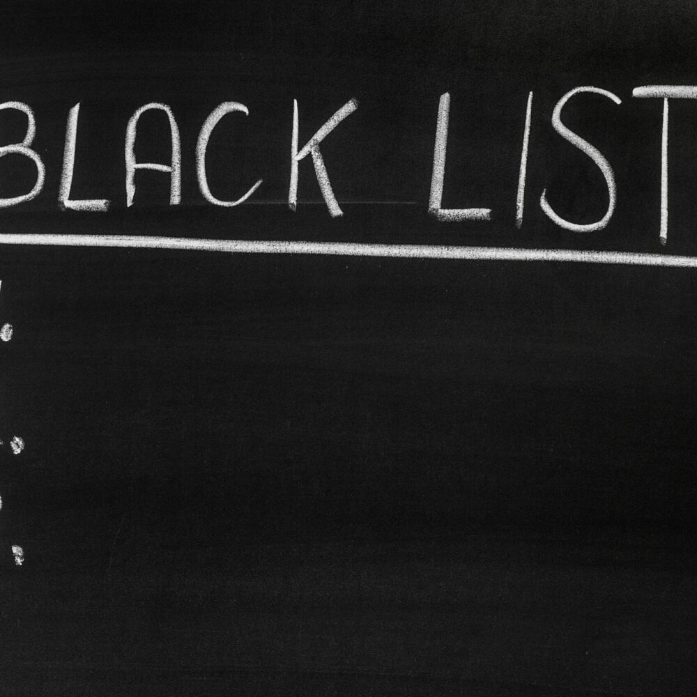 Black list message handwritten on the blackboard